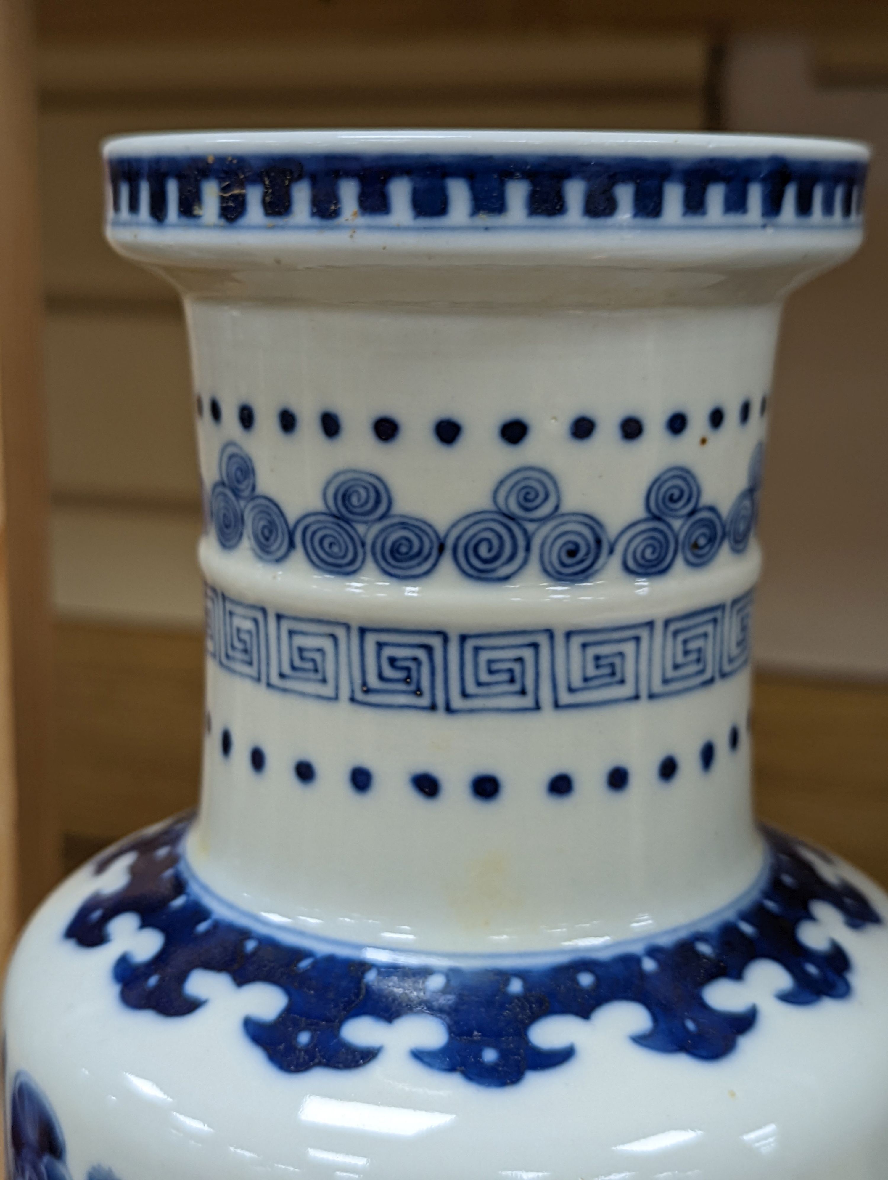 A Chinese blue and white rouleau vase, 35 cms.